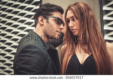 Young and trendy man and woman in love passion emotions of the modern street. Fashion Style