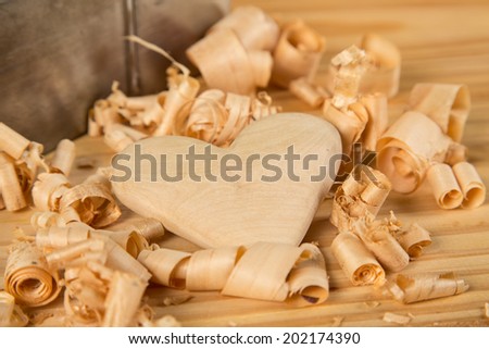 Wood heart with shavings and wood plane