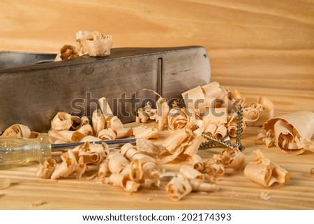 carpenters table with wood plane and shavings