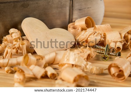 Carpenter work, wood heart,screws and wood plane