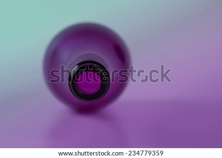 Purple glass bottle with purple  green back lighting
