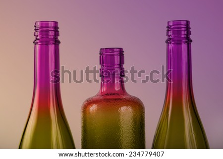 Colorful glass bottles with colored back lighting