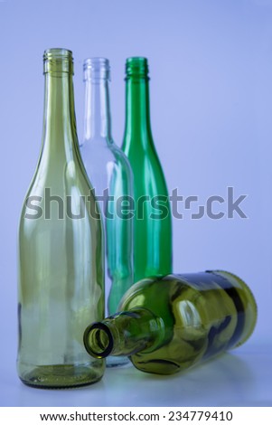 Tree colored glass bottles with colored back lighting