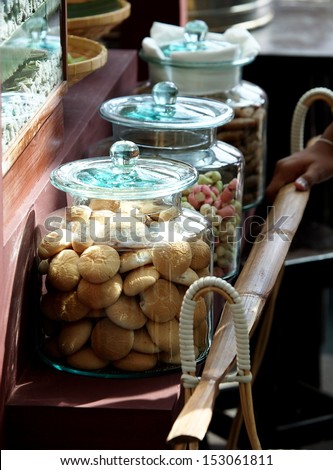Thai retro style food snack sweet and baked exhibition shop show and sale cookies and snacks for tea and coffee in vintage glass jar decorated with retro objects
