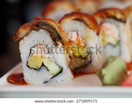 Sushi, typical Japanese food with fresh cooked rice vegetable fish meat sesame and exotic sources with wasabi mustard