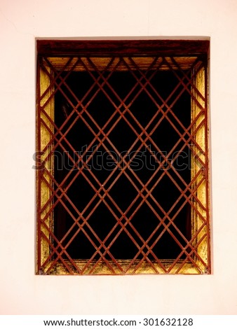 buddhism temple building windows door frame in a province in northern THAILAND with nice smooth golden pattern in north THAI style.