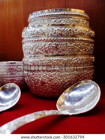large unused vintage retro style silver spoon and water container for sale as home accessories for use and decoration in a silver craft product shop in THAILAND