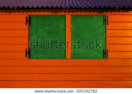 wooden cabin painted in secondary colors