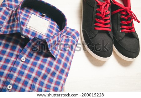 image of a pair of shoes and blue checked shirt
