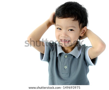 Confused child scratching his head isolated on a white background