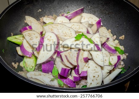 Fried eggplant with garlic sauce in Black pan.