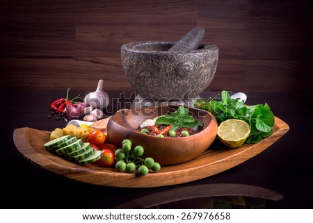 Thai cuisine nam prik or chili paste mixes with fish serves with various vegetables
