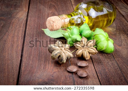 dried capsule seeds fruit of sacha-Inchi peanut on wooden table