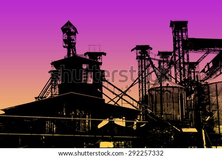 industry silhouettes as against a background of sunset sky