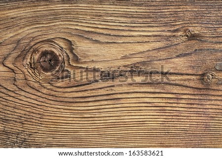 Old Plank, With Wood Knots And Cracked, Layered Rough Surface, Separated By Annual Growth Lines.