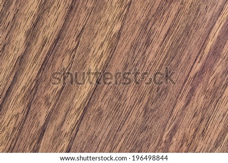 Walnut hardwood texture sample, with featured fine surface grain and annual growth lines