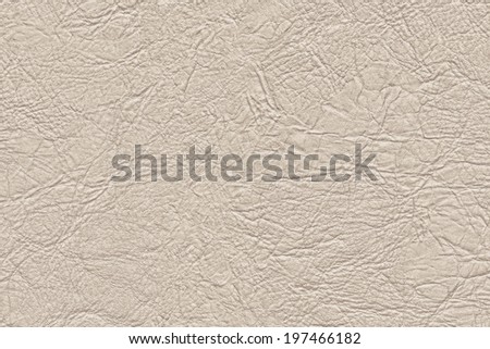 Photograph of coarse, crumpled artificial beige leather texture sample