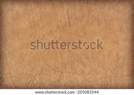 Photograph of old, weathered, rough, creased, coarse grained, exfoliated Brown leather, vignette grunge