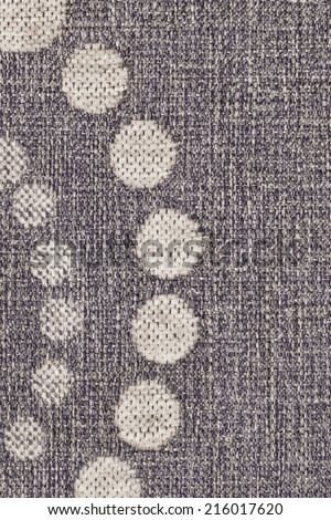 Photograph of dark Gray woven Acrylic Polyethylene upholstery and drapery fabric, with decorative circular pattern, detail.