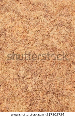 Photograph of vivid Red Ocher recycle paper, extra coarse grain, crumpled, mottled grunge texture sample.