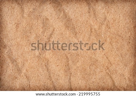 Photograph of Brown Recycle Paper, coarse grain, crumpled, vignette grunge texture sample.