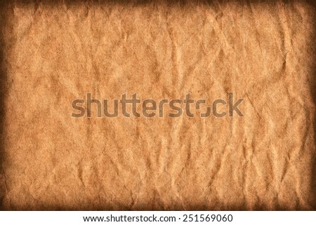 Photograph of old Recycle Kraft Brown Paper, coarse grain, crushed crumpled, vignette grunge texture sample.
