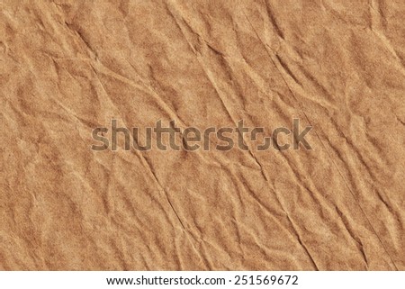 Photograph of old Recycle Kraft Brown Paper, coarse grain, crushed crumpled, grunge texture sample.