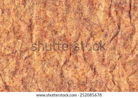 Photograph of old Recycle Kraft Brown Paper, coarse grain, crushed crumpled, mottled, grunge texture sample.