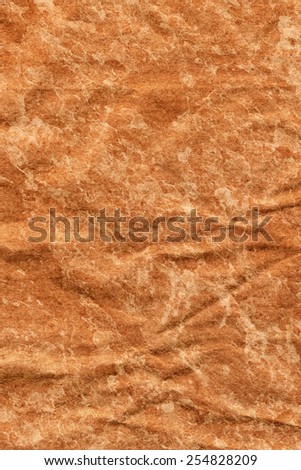 Photograph of old Recycle Kraft Brown Paper, coarse grain, crushed crumpled, bleached, stained, mottled, grunge texture sample.