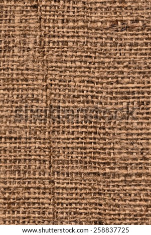 Photograph of raw, roughly woven, coarse grain, burlap grunge texture.