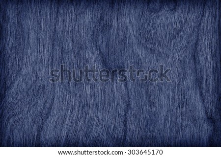Natural Cherry Wood Veneer Bleached and Stained Dark Navy Blue Vignette Grunge Texture Sample.
