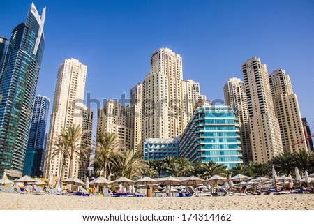 DUBAI - MARCH 23, 2013: Residential skyscrapers, beach and hotel at Dubai Marina taken on March 23, 2013 in Dubai, United Arab Emirates.