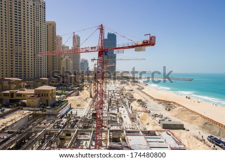 DUBAI - MARCH 24, 2013: Large construction site for a new mall at the beach located at Dubai Marina next to \
