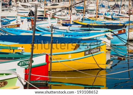 NICE MARCH 07, 2014: Colorful fishing boats at the port of Nice taken on March 07, 2014 in Nice, France