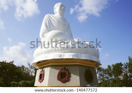 Statue of the Buddha against the blue sky. Temple of the Buddha. Vietnam, Nha Trang, Pagoda.