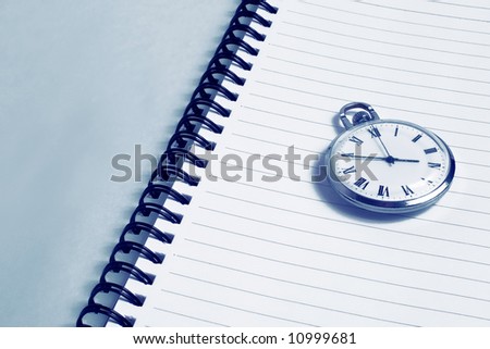 notebook and clock