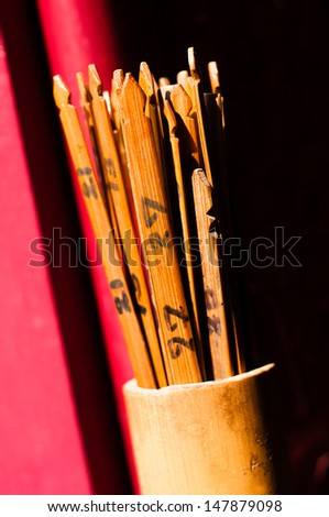 These are used mostly in China temples and serve as oracles. People make shake the bamboo container while muttering a wish, one stick falls out and according to the number their fortune is predicted.