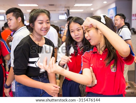 CHIANG MAI THAILAND - SEPTEMBER9 : Students Mont Fort College going to study in China, friend come along to take a souvenir before leaving together at Chiang Mai airport, Thailand on SEPTEMBER9, 2015