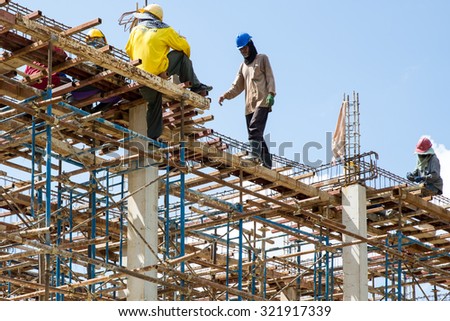 MAE SOT, THAILAND - SEP26 : Myanmar migrant workers in construction commercial building at Mae Sot, Tak, Thailand on SEPTEMBER26,2015