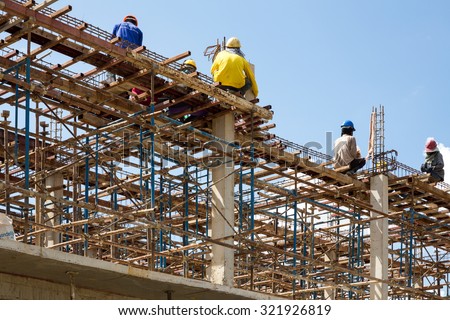 MAE SOT, THAILAND - SEP26 : Myanmar migrant workers in construction commercial building at Mae Sot, Tak, Thailand on SEPTEMBER26,2015