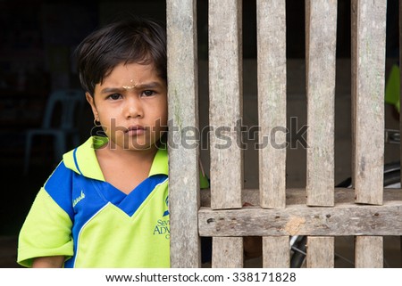 MAE SOT, THAILAND - NOVEMBER11, 2015 : Unidentified girl of migrant workers staying at the non-formal leaning place near plant the parents their work at MAE SOT, THAILAND.