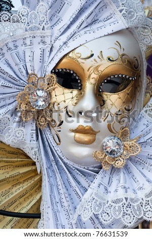 yellow and white venice carnival mask