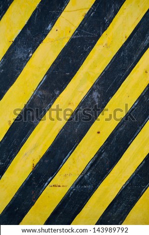 background with stripes of black and yellow paint