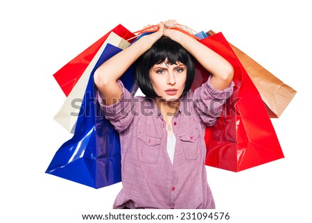 exhausted woman with shopping bags over her head