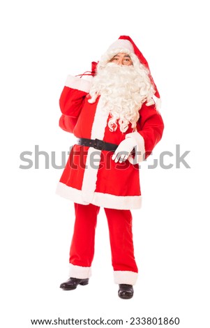 santa claus standing proud and holding his sack of gifts on back