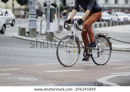 low angle of a casual man on bike