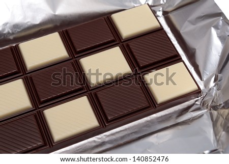 Food collection - Tile black and white chocolate, shallow dof.