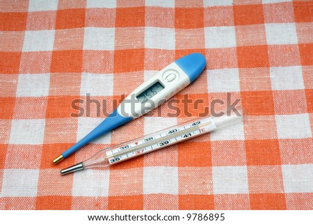 Modern electronic and glass mercury medical thermometers