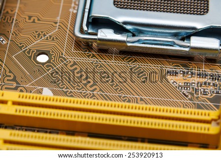 Detail of circuit paths and solderings on a computer mainboard