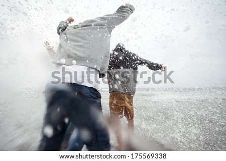 brave man have fun in storm waves